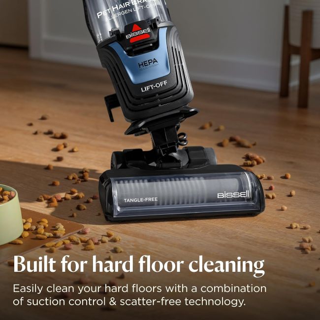 BISSELL Pet Hair Eraser handheld vacuum cleaning pet hair from furniture