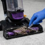 Cleaning a clogged Eureka upright vacuum cleaner hose