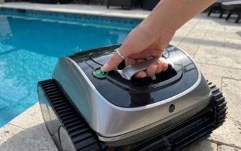Launching Wybot C1 robotic pool vacuum into a swimming pool