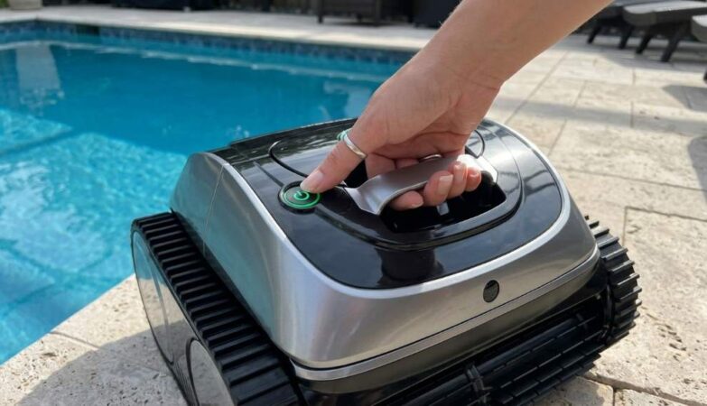 Launching Wybot C1 robotic pool vacuum into a swimming pool