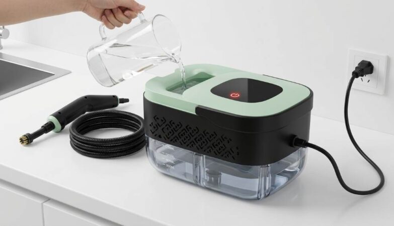 Handheld pressurized steam cleaner resting on clean kitchen countertop