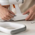 Tikom V500 cordless stick vacuum cleaner standing in modern living room